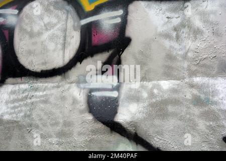 Graffiti-Wort ASTOR, gezeichnet von einem Schoßhund in kräftigen grauen, weißen Buchstaben mit einer interessanten, scharfen Form. Grafisches Design auf chaotische Weise. Stockfoto