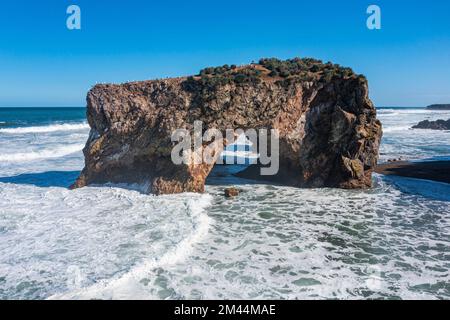 Aerial of a Rock arch, Cape giant, Sakhalin, Russia Stock Photo