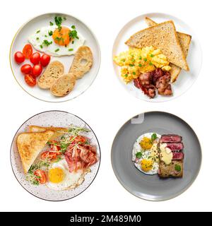 Verschiedene englische Frühstücke mit Spiegelei oder Rührei, Speck und Gemüse auf Tellern, einsamer Blick von oben Stockfoto
