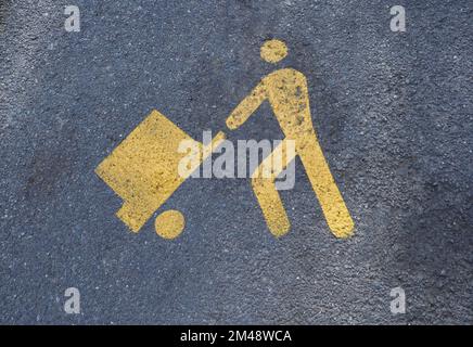 Schild für Be- und Entladebereich auf Asphalt lackiert Stockfoto