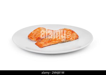 Lachssteak auf weißem Teller isoliert auf weißem Hintergrund Stockfoto