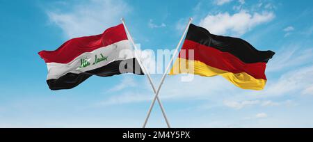 Zwei überkreuzte Flaggen Bundesrepublik Deutschland und Irak winken im Wind am bewölkten Himmel. Beziehungskonzept, Dialog, Reisen zwischen zwei Ländern Stockfoto