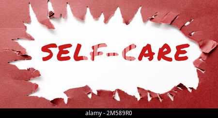 Textzeichen mit „Self Care“ (Selbstpflege). Wort für die Praxis, Maßnahmen zu ergreifen, um die eigene Gesundheit zu verbessern Stockfoto