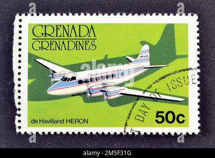 Stornierte Briefmarke, gedruckt von Grenada, die De Havilland Heron zeigt, ca. 1976. Stockfoto