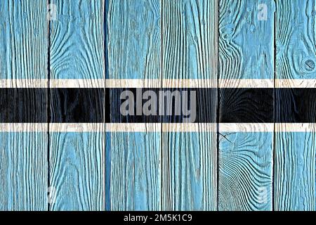 Botswana Flagge auf alten Holzplanke Hintergrund gemalt. Gebürstete natürliche leichte geknotete Holzbrett Textur. Holzstruktur Hintergrundflagge von Botswana. Stockfoto