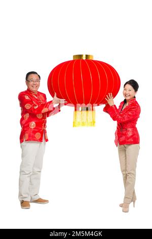 Frohe chinesische Neujahrskostümfamilie Stockfoto
