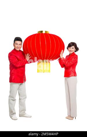 Frohe chinesische Neujahrskostümfamilie Stockfoto