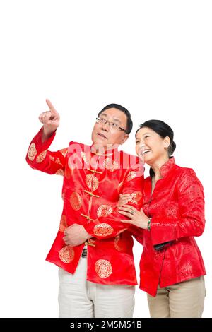 Vergießen Sie glückliches chinesisches Neujahrskostüm, ältere Paare zum plaudern Stockfoto