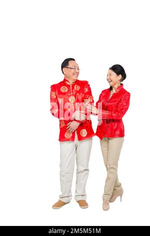 Vergießen Sie glückliches chinesisches Neujahrskostüm, ältere Paare zum plaudern Stockfoto