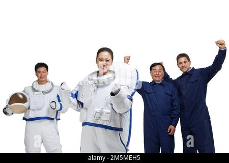 Fotoshooting männlicher Astronauten und Ingenieurteam Stockfoto