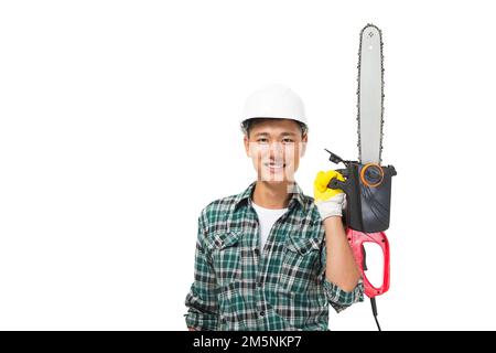 Junge Bauarbeiter mit einer Kettensäge Stockfoto