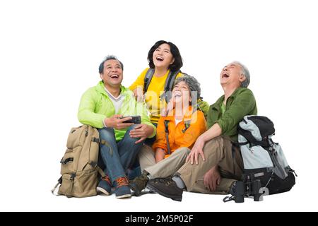 Vier ältere Menschen saßen zusammen, um sich auszuruhen Stockfoto