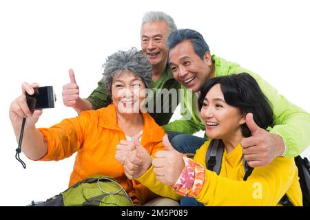 Vier ältere Menschen saßen zusammen, um sich auszuruhen Stockfoto