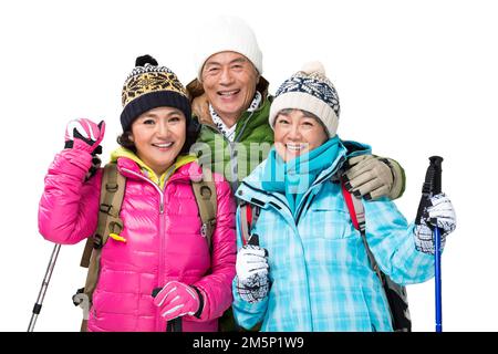 Frohe Winterreise in die Berge der älteren Menschen Stockfoto