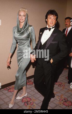Sylvester Stallone und Brigitte Nielsen 1986 Quelle: Ralph Dominguez/MediaPunch Stockfoto