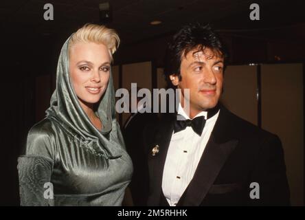 Sylvester Stallone und Brigitte Nielsen 1986 Quelle: Ralph Dominguez/MediaPunch Stockfoto