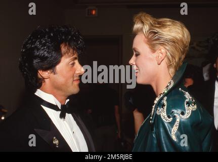 Sylvester Stallone und Brigitte Nielsen bei den National Association of Theater Owners (NATO) Awards 1986 im Century Plaza Hotel in Los Angeles, Kalifornien, 23. Oktober 1986 Kredit: Ralph Dominguez/MediaPunch Stockfoto