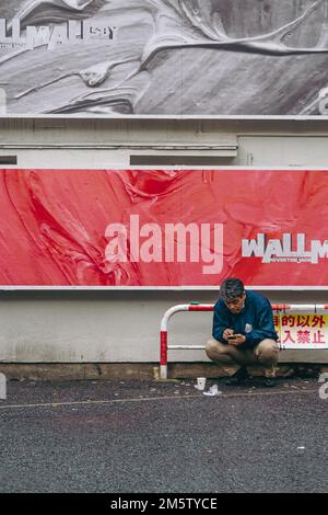 Kommerzielle Werbung in der Shibuya Gasse Stockfoto