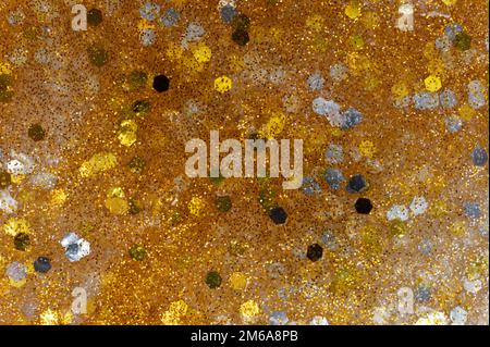 Makro-Nahaufnahme mit goldener, glitzernder Textur Stockfoto