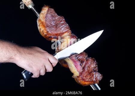 Steak Rotisserie im Steakhouse, Picanha in Scheiben geschnitten Stockfoto