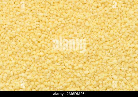 Nahaufnahme des Hintergrunds von Couscous Grains Stockfoto