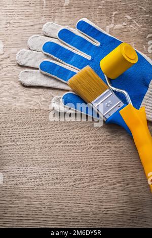 Sicherheitshandschuhe Farbbürstenwalze Konstruktionskonzept. Stockfoto