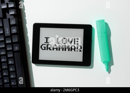 Ein Schild mit der Aufschrift „I Love Grammar“. Unternehmerische Betrachtungsweise der Bewunderung des Systems und der Sprachstruktur Stockfoto