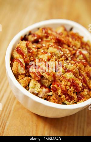 Hühnchen-Curry mit Reis, Schweinekotelett Stockfoto