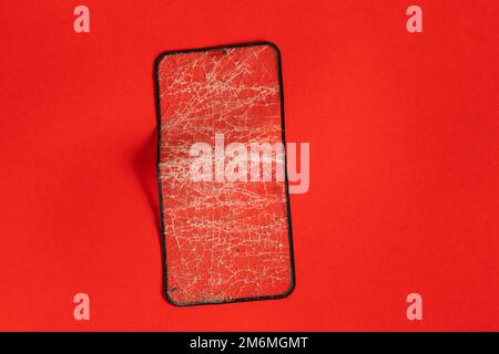 Zerbrochenes gehärtetes Schutzglas für das Telefon Stockfoto