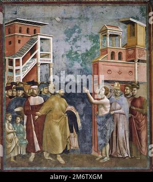 Eine Szene aus der Legende des Heiligen Franziskus von Assisi vom Florentiner Schulmaler Giotto Di Bondone. Diese Szene zeigt den Verzicht auf Wordly-Waren Stockfoto
