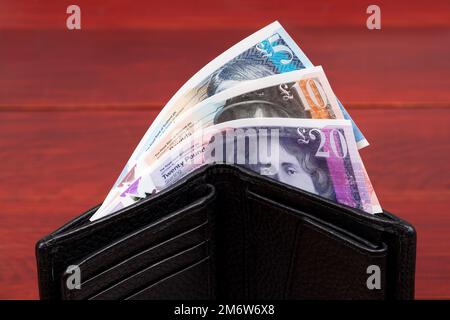 Schottisches Geld - Pfund in einer schwarzen Brieftasche Stockfoto