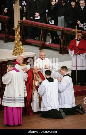A priest at the funeral of Pope Emeritus Benedict XVI at St. Peter's ...
