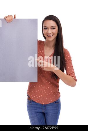 Zum Beispiel, was du liest. Studio-Porträt einer jungen Frau, die ein leeres Schild auf weiß hält. Stockfoto