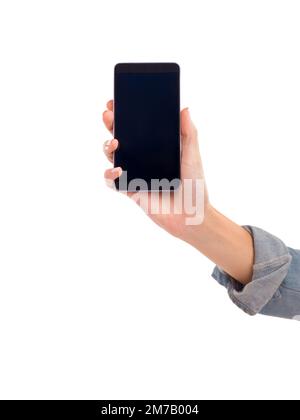Das ist das Telefon, auf das du gewartet hast. Eine Frauenhand, die ein Smartphone hält. Stockfoto