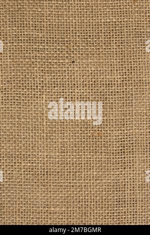 Hessischer Hanf mit Leinengewebe Hintergrund, natürliches Material. Wird für Abschlags- und Bastelprojekte verwendet Stockfoto