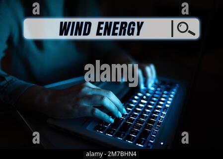 Schild mit der Aufschrift Windenergie. Ein Wort über den Prozess, bei dem Wind zur Stromerzeugung verwendet wird Stockfoto