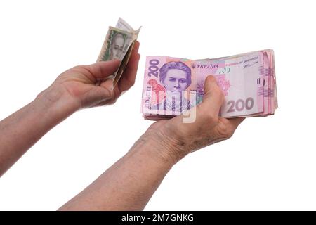 Eine alte Frau mit Geld in der Hand. Stockfoto