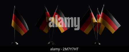 Kleine Nationalflaggen der Bundesrepublik Deutschland auf schwarzem Hintergrund Stockfoto