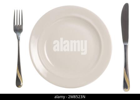 Eine Platte mit Gabel und Messer auf weiß Stockfoto