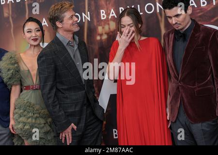 li-jun-li-from-left-brad-pitt-and-margot-robbie-pose-for