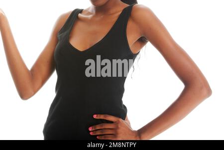 Körpersprache des Selbstbewussten. Zugeschnittenes Bild einer jungen Frau in einer Präsentation isoliert auf Weiß. Stockfoto