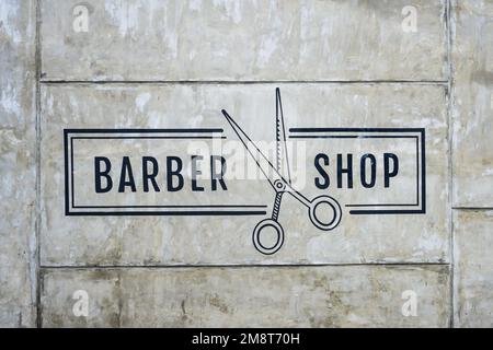 Friseurshop-Inschrift und Schere-Illustration Stockfoto