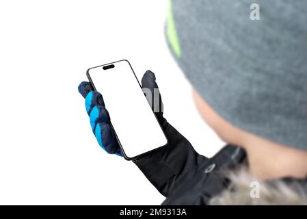 Telefon in der Hand eines Jungen. Isolierte Anzeige und Hintergrund für Modellerstellung, Präsentation von App-Design Stockfoto