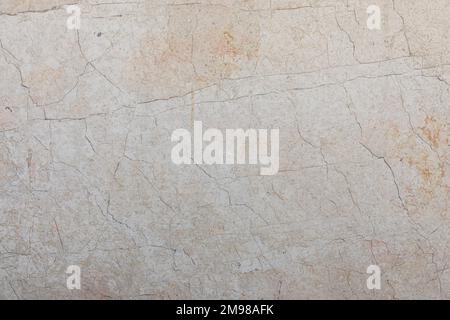 Hintergrund und Textur cremefarbener Marmorsteine mit Venen. Stockfoto