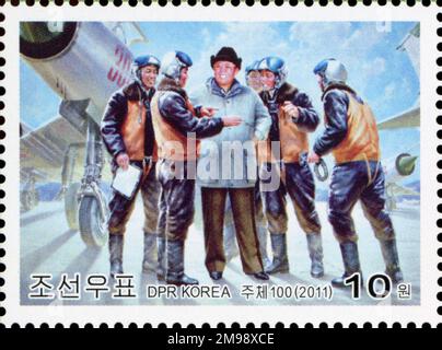 2011 Nordkorea-Stempel. Kim Jong Ils Ernennung zum Oberbefehlshaber der Armee zum 20. Jahrestag. Kim Jong Il und Militärpiloten Stockfoto