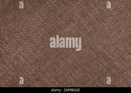 Gewebte Polsterung im Jacquard-Design, braune, grobe Gewebestruktur mit diagonalen Weblinien. Textilhintergrund, Möbeltextilien, Tapete, Hintergrund. Stockfoto