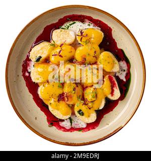 Faule Knödel mit Vanille und Kirschsoße Stockfoto