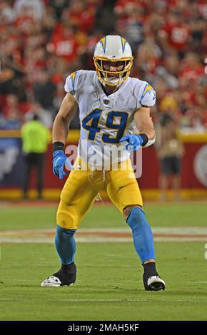 Los Angeles Chargers linebacker Drue Tranquill (49) tackles Kansas City  Chiefs wide receiver JuJu Smith-Schuster (9) during an NFL football game  Thursday, Sep. 15, 2022, in Kansas City, Mo. (AP Photo/Peter Aiken