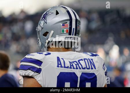 Dallas Cowboys offensive tackle Isaac Alarcon wears the flag of