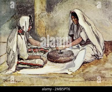 Two Women Grinding at a Hand-Mill Painted by John Fulleylove aus dem Buch " The Holy Land " beschrieben von John Kelman 1864-1929 Publisher London : A. & C. Black. Publisher 1902 Stockfoto